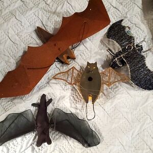 3 hanging bats and one ornament bat